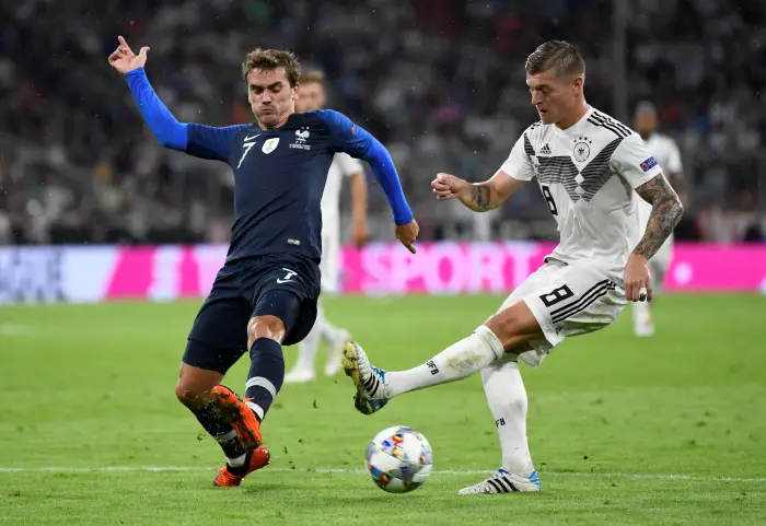 France's Antoine Griezmann in action with Germany's Toni Kroos