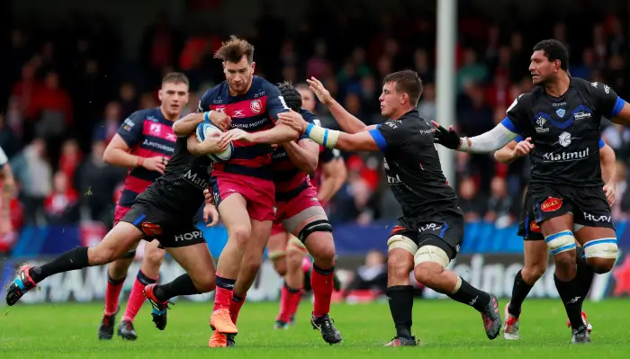 Gloucester's Mark Atkinson in action with Castres' Robert Ebersohn and Baptiste Delaporte
