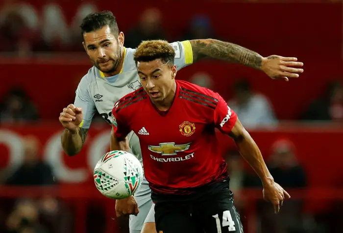 Soccer Football - Carabao Cup - Third Round - Manchester United v Derby County - Old Trafford, Manchester, Britain - September 25, 2018  Manchester United's Jesse Lingard in action with Derby County's Bradley Johnson