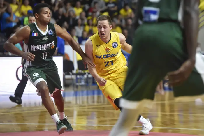 Radovan Kouril of Opava, center, and Dominic Waters of Nanterre, left, in action during the Men's Basketball Champions League group B first round game Opava vs Nanterre in Opava, Czech Republic, October 10, 2018.