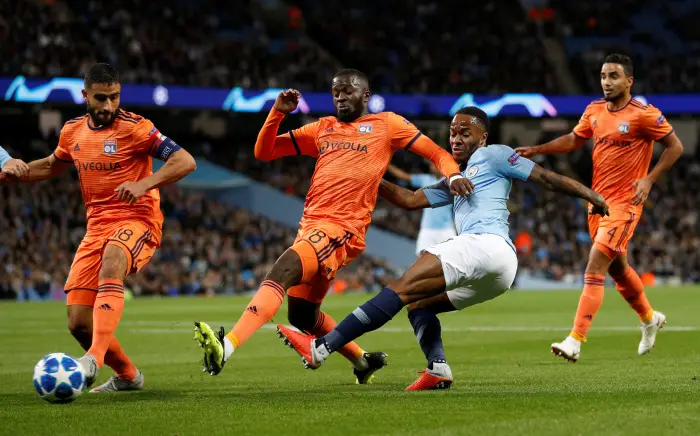 Manchester City's Raheem Sterling in action with Lyon's Tanguy Ndombele and Nabil Fekir