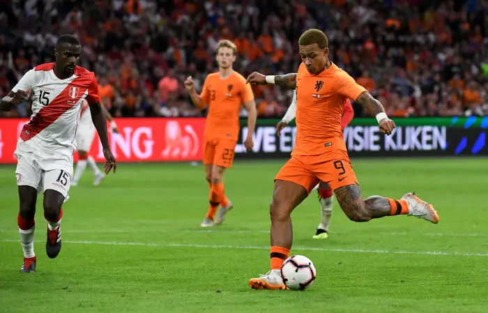 Netherlands' Memphis Depay scores their first goal
