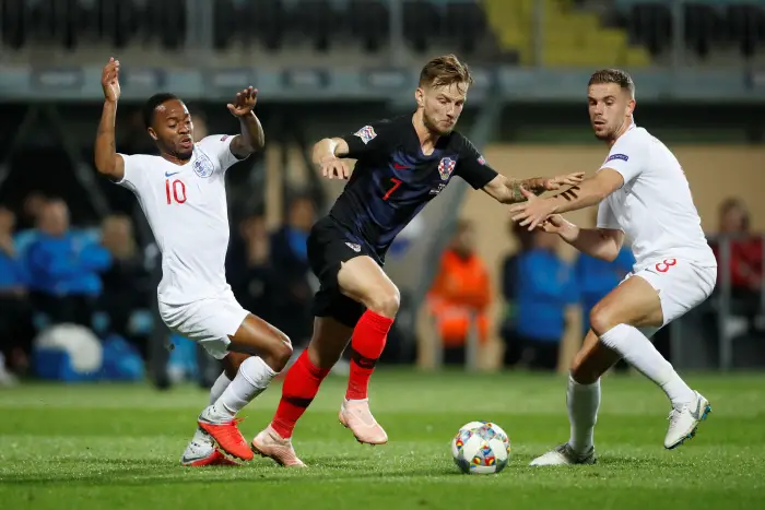 Croatia's Ivan Rakitic in action with England's Raheem Sterling and Jordan Henderson