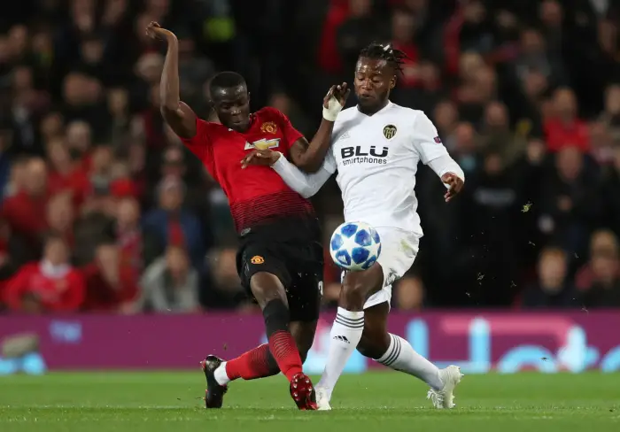 Valencia's Michy Batshuayi in action with Manchester United's Eric Bailly
