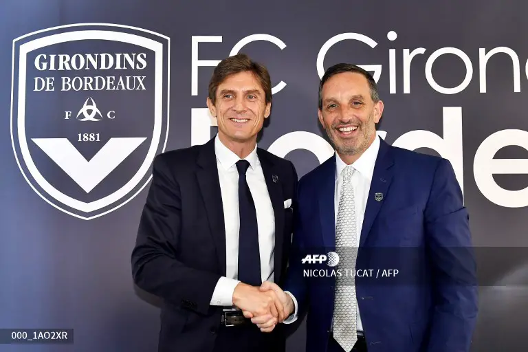 US businessman, President of the GACP investment fund and new owner of the Girondins de Bordeaux football club, Joseph DaGrosa (R) poses after a press conference introducing the club's new president Frederic Longuepee (L) at the club's headquarters in Le Haillan, southwestern France, on November 8, 2018. (Photo by NICOLAS TUCAT / AFP)