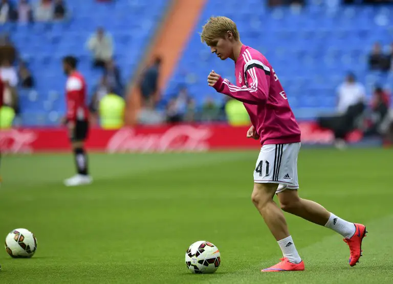 Real Madrid's Norwegian midfielder Martin Oedegaard warms up before the Spanish league football match Real Madrid CF vs UD Almeria at the Santiago Bernabeu stadium in Madrid on April 29, 2015.   AFP PHOTO/ JAVIER SORIANO (Photo by JAVIER SORIANO / AFP)
