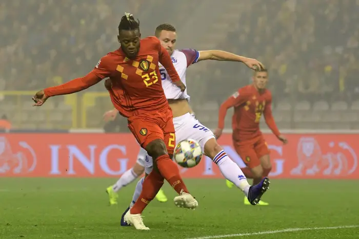 Michy Batshuayi forward of Belgium battles for the ball with Sverrir Ingason defender of Iceland