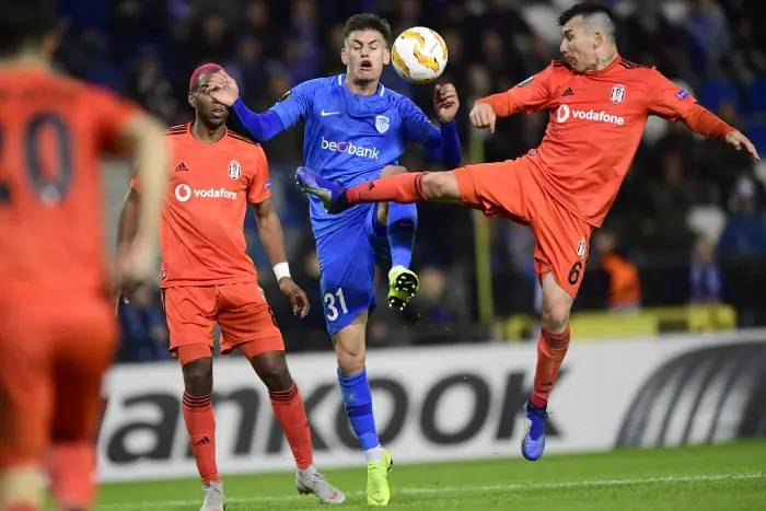 GENK, BELGIUM - NOVEMBER 8 : Joakim Maehle forward of Genk and Gary Medel midfielder of Besiktas JK jumping towards the ball during the UEFA Europa League, Group Stage - Group 1 match between KRC Genk and Besiktas JK at the KRC Genk Arena on November 08, 2018 in Genk, Belgium, 8/11/2018 (