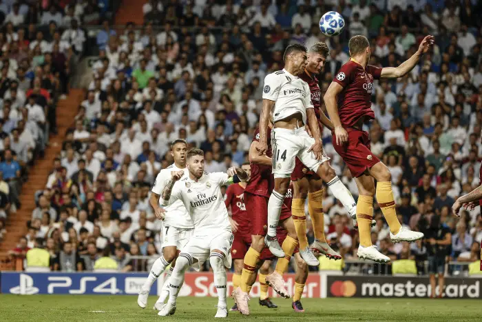 Carlos Enrique Casemiro (Real Madrid)  fights for the header with   UCL Champions League match between Real Madrid vs Roma at the Santiago Bernabeu stadium in Madrid, Spain, September 19, 2018 .