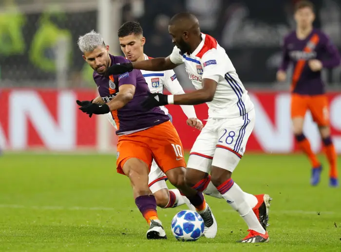 Manchester City's Sergio Aguero in action with Lyon's Tanguy Ndombele