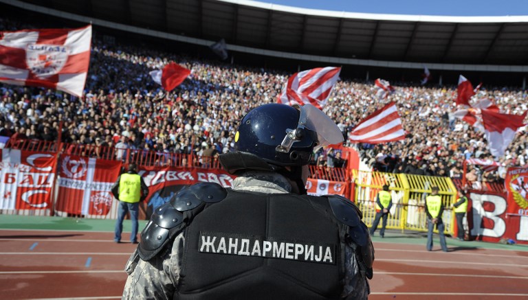 Serbian anti riot police officers stands guard inside Belgrade's "Marakana" stadium prior to the Serbian football derby match on October 23, 2010. Heavy police presence and strict fans' control prevented feared violence at the tense Serbian derby today won by Partizan against its main local rival Red Star Belgrade. Several thousands policemen were engaged since early morning hours, controlling groups of fans coming to the match in a clear bid to avoid any incidents following violent riots by Serbian hooligans on October 12 in aborted Serbia's Euro 2012 qualifier against Italy in Genoa.  AFP PHOTO / Andrej ISAKOVIC (Photo by ANDREJ ISAKOVIC / AFP)