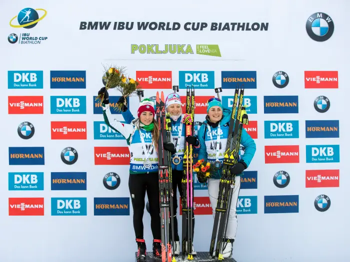 POKLJUKA,SLOVENIA,08.DEC.18 - BIATHLON - IBU World Cup, 7.5km sprint competition, ladies, award ceremony. Image shows Dorothea Wierer (ITA), Kaisa Makarainen (FIN) and Justine Braisaz (FRA).