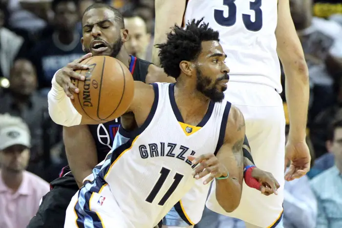 Memphis Grizzlies guard Mike Conley (11) dribbles around a screen as Los Angeles Clippers guard Chris Paul (3)
