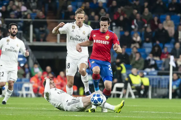 Real Madrid Marcos Llorente and Federico Valverde and PFC CSKA Moskva Kristijan Bistrovic during UEFA Champions League match between Real Madrid and PFC CSKA Moskva at Santiago Bernabeu Stadium in Madrid, Spain. December 12, 2018.