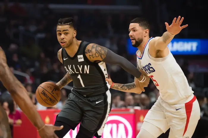 Brooklyn Nets Guard D'Angelo Russell (1) drives the ball inside against Los Angeles Clippers Guard Austin Rivers (25)