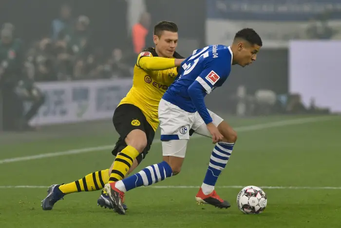 GER 1 FBL FC Schalke 04 vs Borussia Dortmund 08 12 2018 Veltins Arena Gelsenkirchen GER 1 FBL FC Schalke 04 vs Borussia Dortmund DFL regulations prohibit any use of photographs as image sequences and or quasi video in picture v left in duel Lukasz Piszczek 26 Borussia Dortmund Amine Harit 25 FC Schalke 04