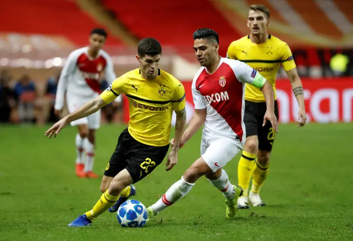 Borussia Dortmund's Christian Pulisic in action with AS Monaco's Radamel Falcao