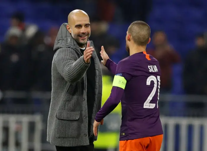 Manchester City manager Pep Guardiola shakes the hand of David Silva after the match