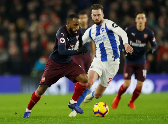 Soccer Football - Premier League - Brighton & Hove Albion v Arsenal - The American Express Community Stadium, Brighton, Britain - December 26, 2018  Arsenal's Alexandre Lacazette in action with Brighton's Davy Propper