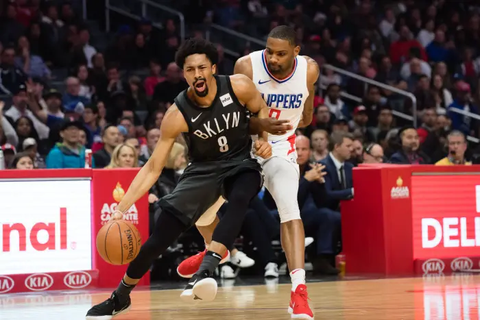 Brooklyn Nets Guard Spencer Dinwiddie (8) collides with Los Angeles Clippers Guard Sindarius Thornwell (0) as they go to the basket