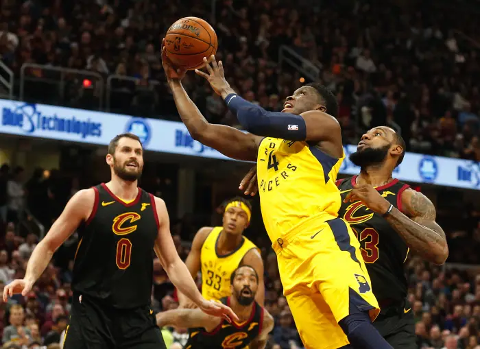 April 25, 2018 - Cleveland, OH, USA - The Indiana Pacers' Victor Oladipo scores against the Cleveland Cavaliers' LeBron James in the first quarter in Game 5 of a first-round playoff series on Wednesday, April 25, 2018, at Quicken Loans Arena in Cleveland.