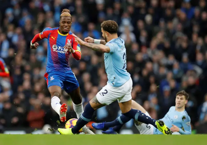 Crystal Palace's Wilfried Zaha in action with Manchester City's Kyle Walker
