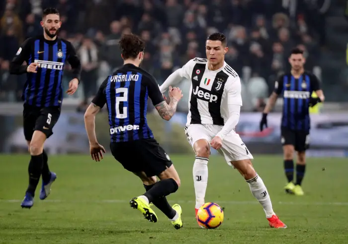 Soccer Football - Serie A - Juventus v Inter Milan - Allianz Stadium, Turin, Italy - December 7, 2018  Juventus' Cristiano Ronaldo in action with Inter Milan's Sime Vrsaljko