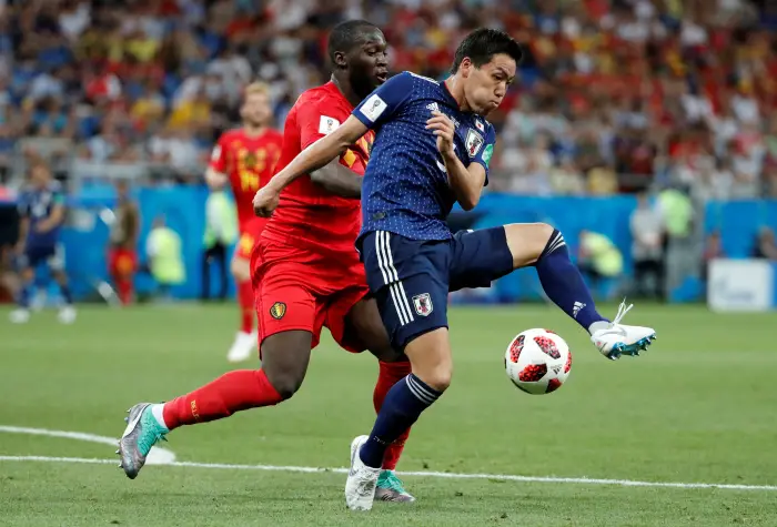 Japan's Gen Shoji in action with Belgium's Romelu Lukaku