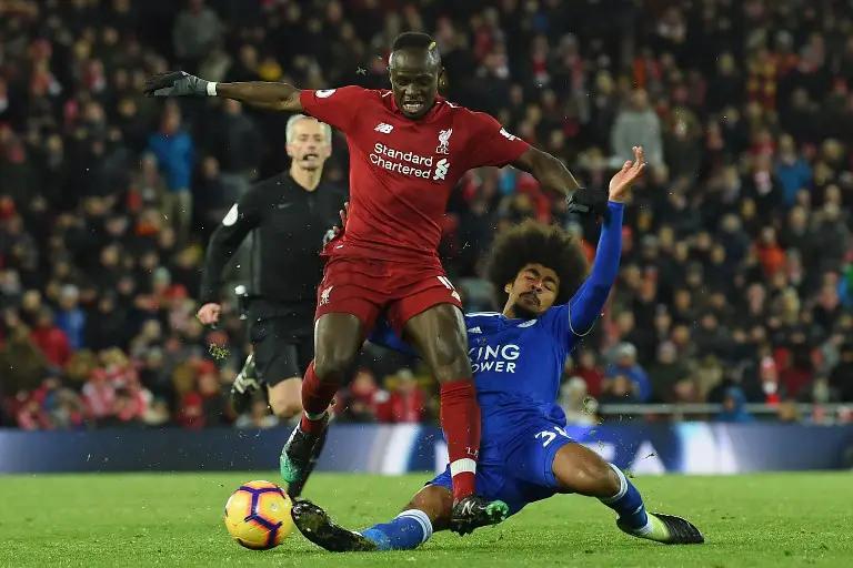 Liverpool's Senegalese striker Sadio Mane (L) is tackled by Leicester City's English midfielder Hamza Choudhury (R) during the English Premier League football match between Liverpool and Leicester City at Anfield in Liverpool, north west England on January 30, 2019. (Photo by Paul ELLIS / AFP) / RESTRICTED TO EDITORIAL USE. No use with unauthorized audio, video, data, fixture lists, club/league logos or 'live' services. Online in-match use limited to 120 images. An additional 40 images may be used in extra time. No video emulation. Social media in-match use limited to 120 images. An additional 40 images may be used in extra time. No use in betting publications, games or single club/league/player publications. /