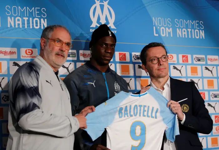 Olympique Marseille's newly-signed player Mario Balotelli poses with his jersey as he attends a news conference in Marseille, France, January 23, 2019.