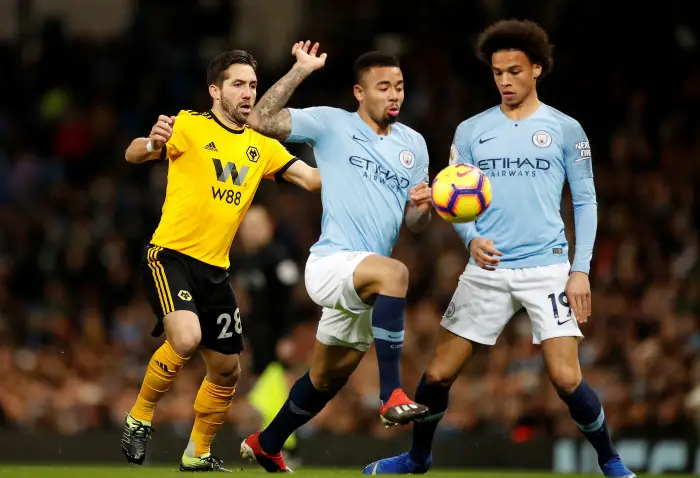 Manchester City's Gabriel Jesus and Leroy Sane in action with Wolverhampton Wanderers' Joao Moutinho