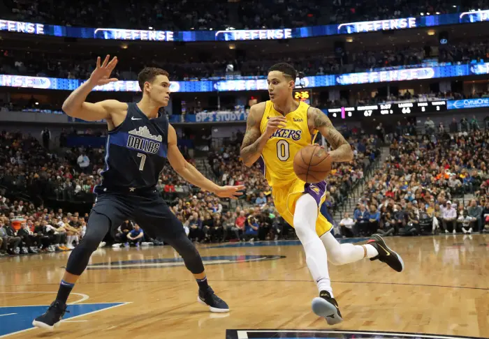 January 13, 2018 - Dallas, TX, USA - The Los Angeles Lakers' Kyle Kuzma (0) drives against the Dallas Mavericks' Dwight Powell (7) in the third quarter at American Airlines Center in Dallas on Saturday, Jan. 13, 2018. The Lakers won, 107-101, in overtime.