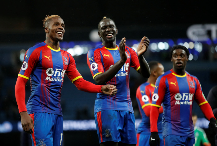 Crystal Palace's Wilfried Zaha and Mamadou Sakho celebrate after the match