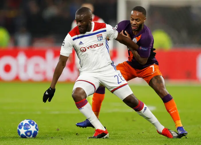 Lyon's Tanguy Ndombele in action with Manchester City's Raheem Sterling