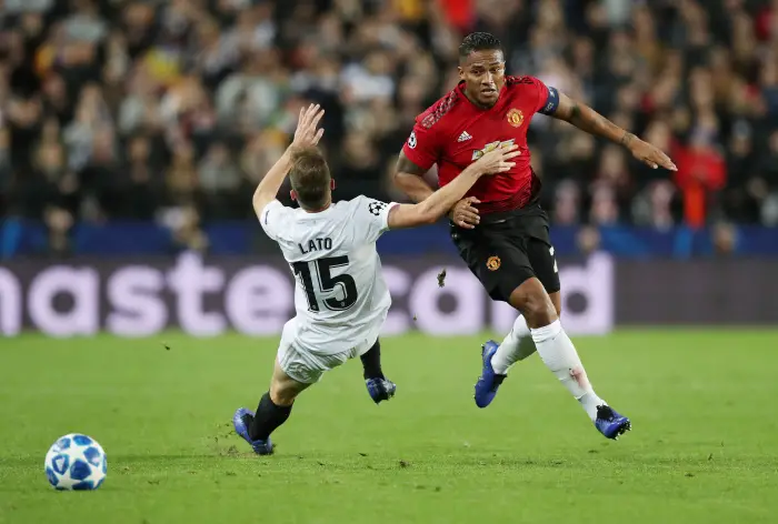 Soccer Football - Champions League - Group Stage - Group H - Valencia v Manchester United - Mestalla, Valencia, Spain - December 12, 2018  Manchester United's Antonio Valencia in action with Valencia's Toni Lato