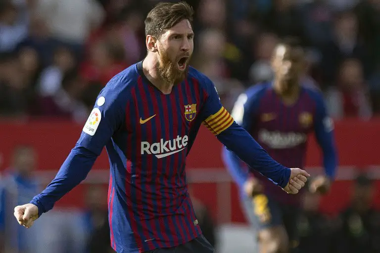 Barcelona's Argentinian forward Lionel Messi celebrates after scoring a goal during the Spanish league football match between Sevilla FC and FC Barcelona at the Ramon Sanchez Pizjuan stadium in Seville on February 23, 2019. (Photo by JORGE GUERRERO / AFP)