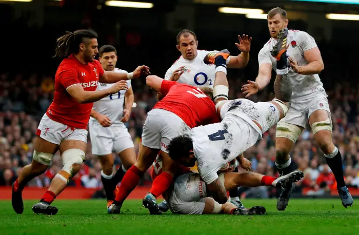 Principality Stadium, Cardiff, Britain - February 23, 2019  England's Courtney Lawes, Ben Moon and George Kruis in action with Wales' Tomas Francis and Josh Navidi