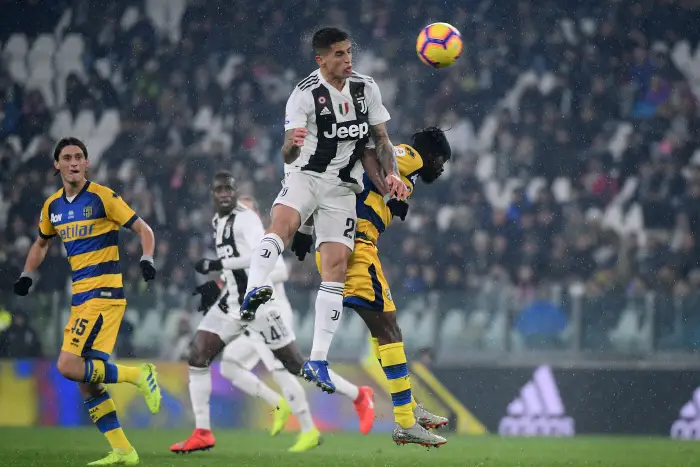 Joao Cancelo of Juventus and Gervinho of Parma compete for the ball