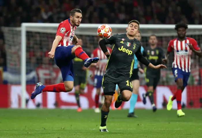 Atletico Madrid's Koke in action with Juventus' Paulo Dybala