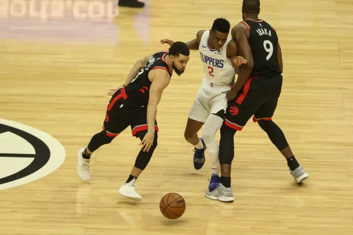 December 11, 2018  Los Angeles, CA..LA Clippers guard Shai Gilgeous-Alexander #2 fighting over screen to guard Toronto Raptors guard Fred VanVleet #23 during the Toronto Raptors vs Los Angeles Clippers at Staples Center on December 11, 2018.
