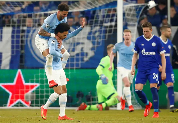 Manchester City's Leroy Sane celebrates scoring their second goal with Kyle Walker