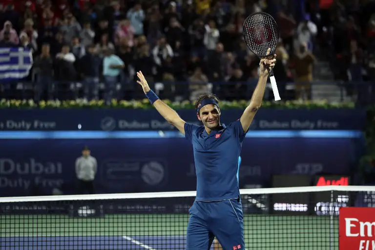 Switzerland's Roger Federer celebrates after winning the final match at the ATP Dubai Tennis Championship in the Gulf emirate of Dubai on March 2, 2019. - Roger Federer won his 100th career title when he defeated Greece's Stefanos Tsitsipas 6-4, 6-4 in the final of the Dubai Championships. (Photo by Karim Sahib / AFP)
