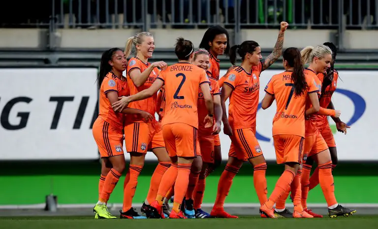 Lyon's English defender Lucy Bronze (3rd L) celebrates scoring the opening goal with her teammates during the UEFA women's Champions League quarter-final, second-leg football match between Vfl Wolfsburg and Olympique Lyonnais in Wolfsburg, western Germany on March 27, 2019. (Photo by Ronny Hartmann / AFP)