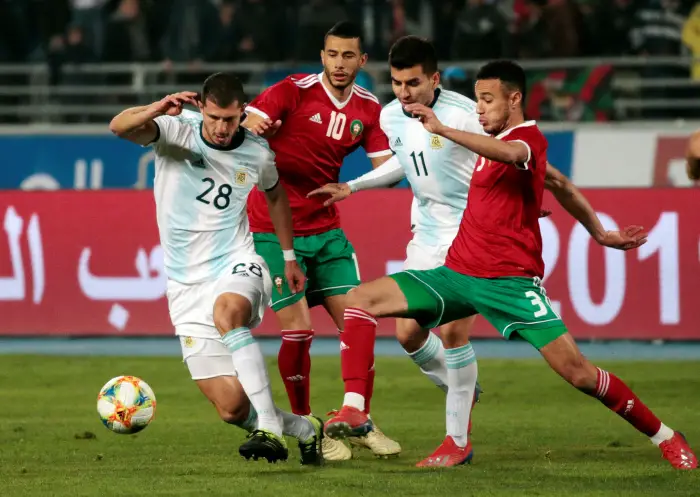 Argentina's Guido Rodriguez and Angel Correa in action with Morocco's Younes Belhanda and Noussair Mazraoui