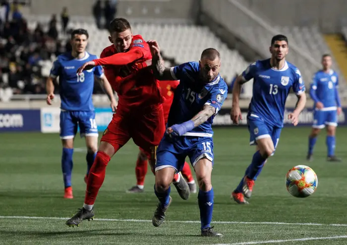Cyprus' Fotis Papoulis in action with Belgium's Thorgan Hazard