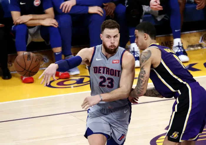 Detroit Pistons' Blake Griffin (23) passes the ball while defended by Los Angeles Lakers Kyle Kuzma (0)