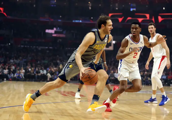 Indiana Pacers forward Bojan Bogdanovic (44) dribbles past Los Angeles Clippers guard Shai Gilgeous-Alexander (2)