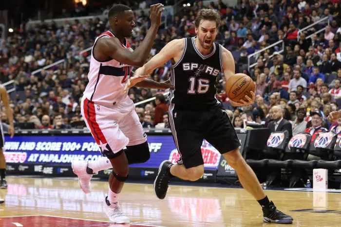 San Antonio Spurs center Pau Gasol (16) dribbles the ball as Washington Wizards center Ian Mahinmi (28)