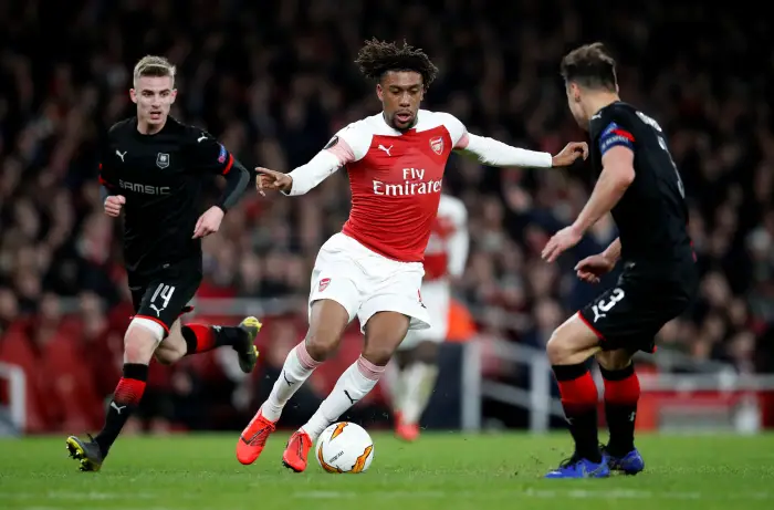 Soccer Football - Europa League - Round of 16 Second Leg - Arsenal v Stade Rennes - Emirates Stadium, London, Britain - March 14, 2019  Arsenal's Alex Iwobi in action with Stade Rennes' Benjamin Bourigeaud