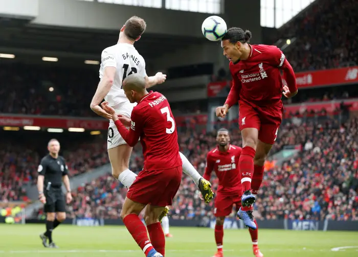 Soccer Football - Premier League - Liverpool v Burnley - Anfield, Liverpool, Britain - March 10, 2019  Liverpool's Virgil van Dijk and Fabinho in action with in action with Burnley's Ashley Barnes